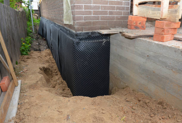Happy homeowners after waterproofing job in Valders